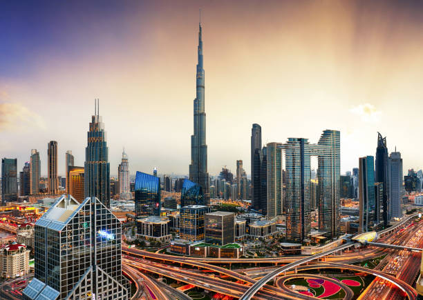 A stunning view of Dubai's skyline at sunset, featuring the iconic Burj Khalifa, related to residence visa.